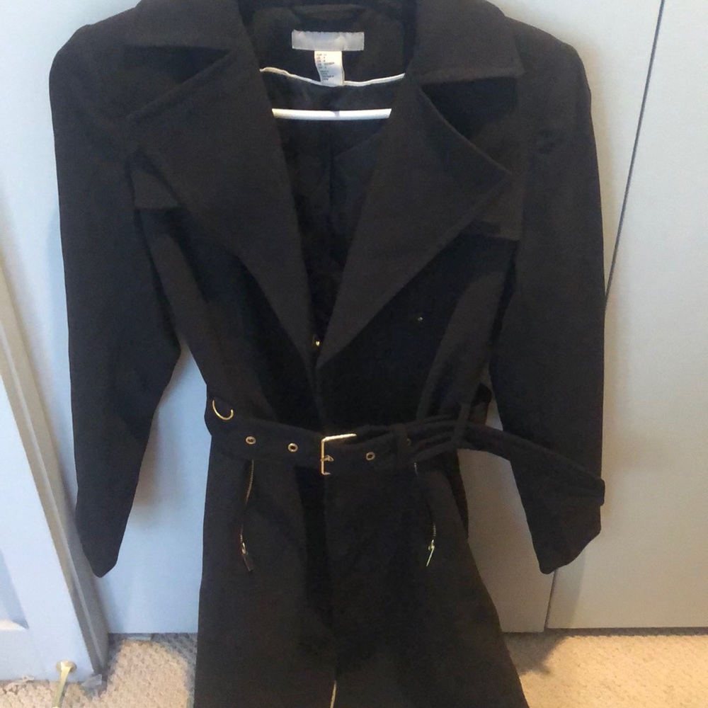 Classic black trench coat with gold detail